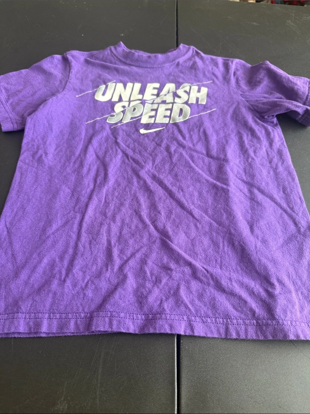Nike Kids Purple Graphic Tee with White 'Unleash Speed' Logo